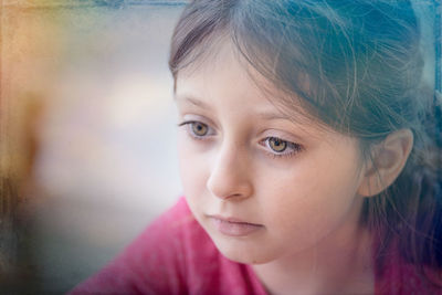 Close-up portrait of girl looking away