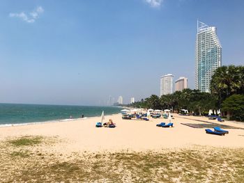 View of beach with city in background