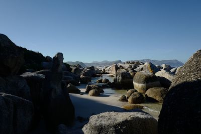Stack of rocks against clear sky