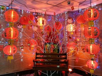 Close-up of illuminated lanterns hanging at night