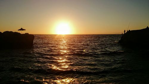 Scenic view of sea at sunset