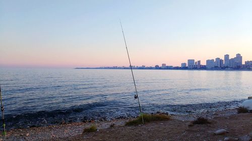 Scenic view of sea against clear sky during sunset