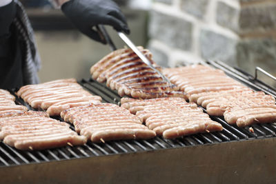 High angle view of sausages on barbecue grill at market