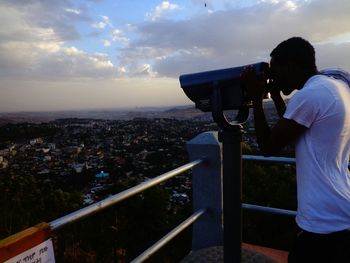 Man looking at cityscape