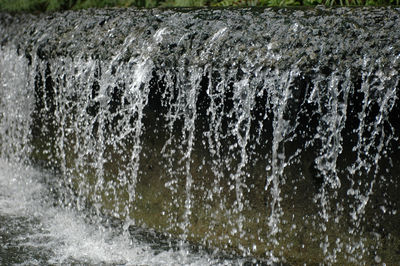 Close-up of water splashing on rocks