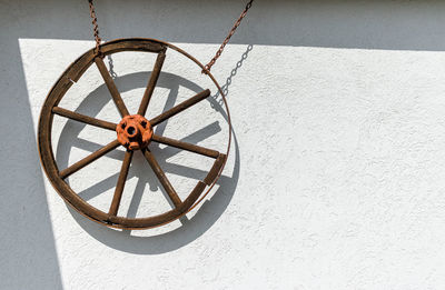 Close-up of wheel on wall