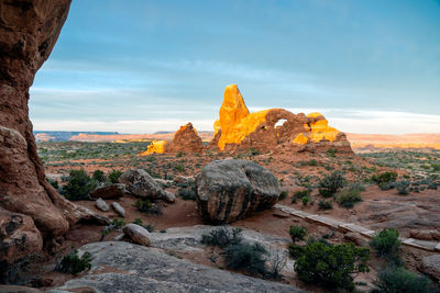 Rock formations on landscape against sky