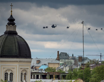 Helicopters by church