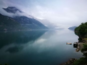 Scenic view of mountains against cloudy sky