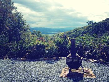 Scenic view of mountains against cloudy sky