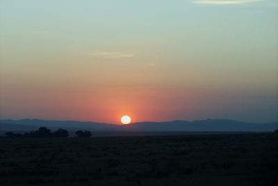 Scenic view of silhouette landscape against sky during sunset