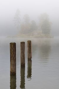 Scenic view of lake during foggy weather