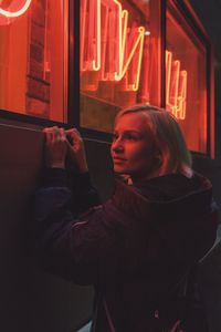 Man photographing while using mobile phone