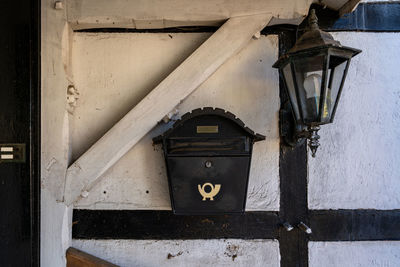 Old lantern and mailbox on the wall.