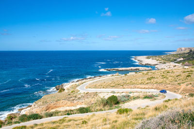 Scenic view of sea against blue sky