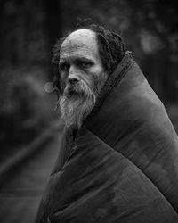 Portrait of man looking away outdoors