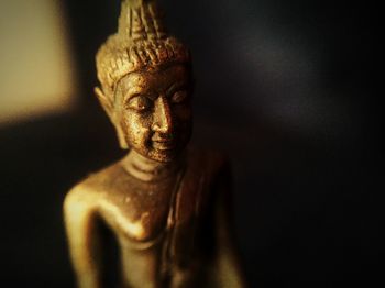 Close-up of metallic buddha statue