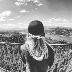 Rear view of woman at observation point looking at river