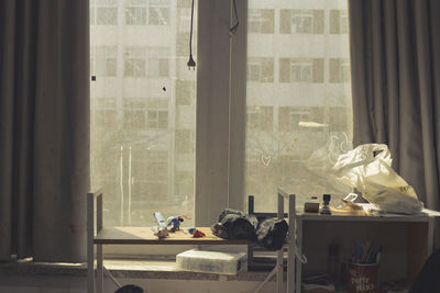 People seen through glass window at home