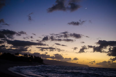 Scenic view of sea against sky at sunset