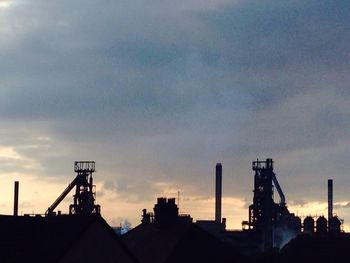 Low angle view of crane against clear sky