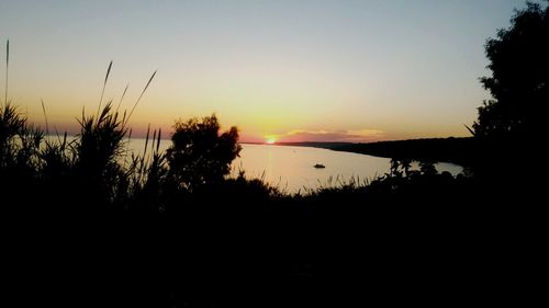 Scenic view of lake during sunset
