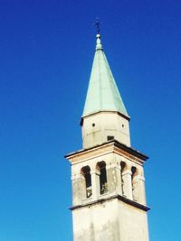 Low angle view of church against blue sky