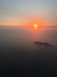 Scenic view of sea against sky at sunset