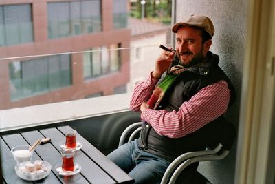 Young man smoking cigarette