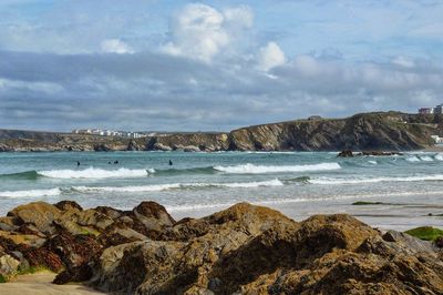 Scenic view of sea and rock formations against sky