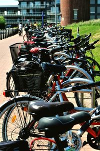 Close-up of bicycles parked in city