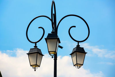 Low angle view of street light against sky