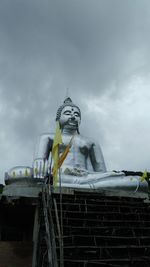 Low angle view of statue against sky