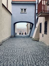 Footpath amidst houses in town