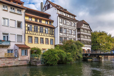 Historic houses on the embankment of the ill river in petite france district in strasbourg, france