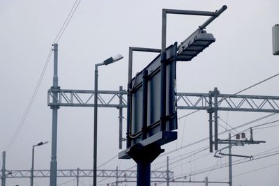 Low angle view of street light against sky