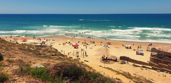 High angle view of people on beach against sky