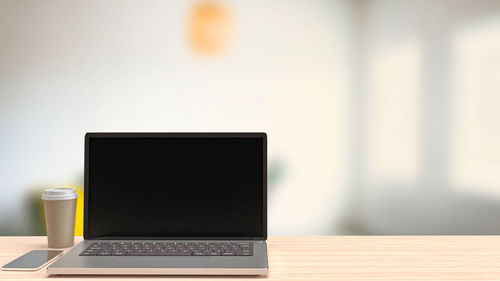 Close-up of laptop on table