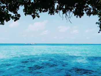 Scenic view of sea against blue sky