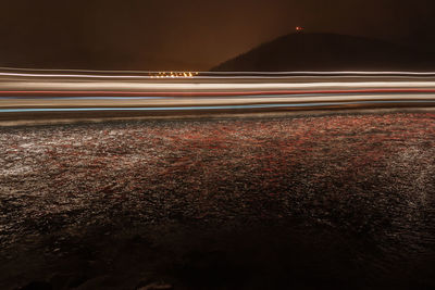 Light trails against sky at night