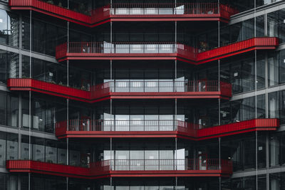 Red balconies on a modern residential building