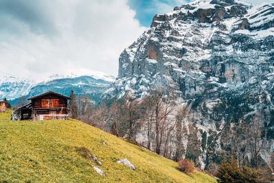 Panoramic shot of building and mountains against sky