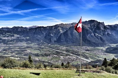 Scenic view of landscape and mountains against sky