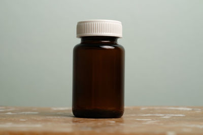 Close-up of glass bottle on table