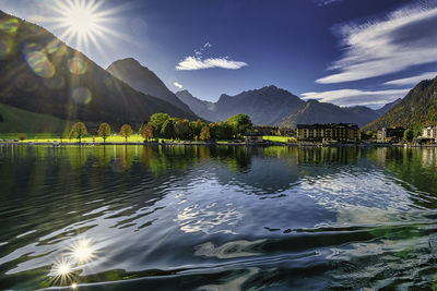 Scenic view of lake and mountains against sky