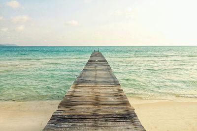 Pier over sea against sky