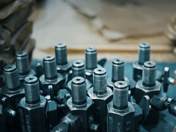 Close-up of machine parts on table at factory