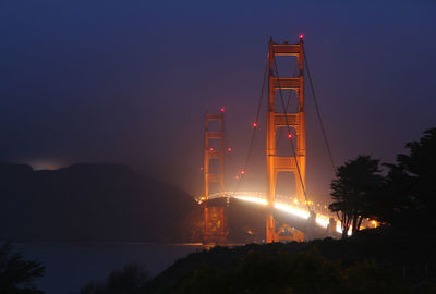 Illuminated golden gate bridge at night