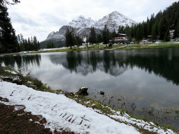 Snow covered peacs reflecting in the beautiful lake antorno, dolomites, italy