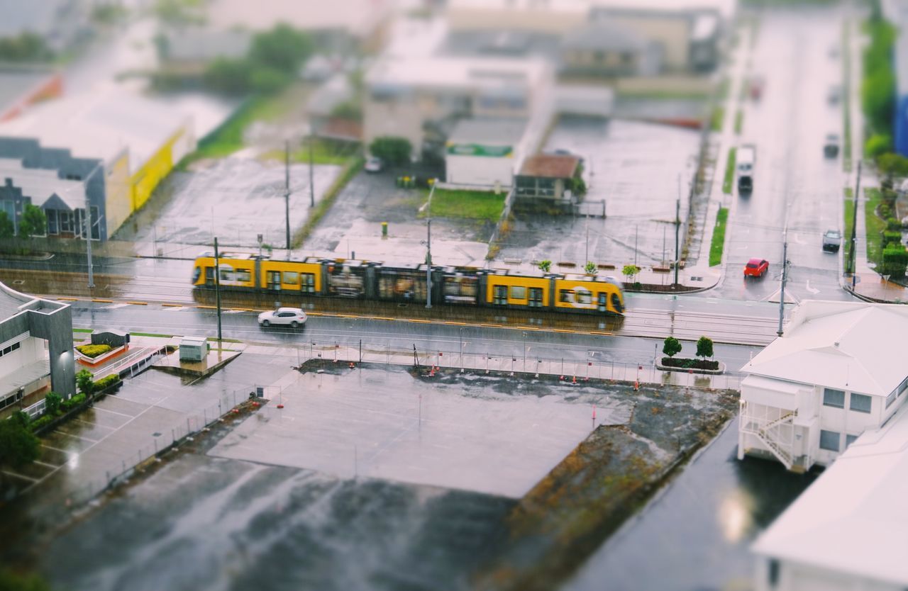 HIGH ANGLE VIEW OF TRAIN ON STREET